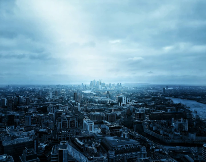 a large city has dark blue buildings and water