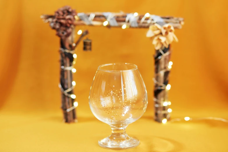 an empty glass with an arch in the background