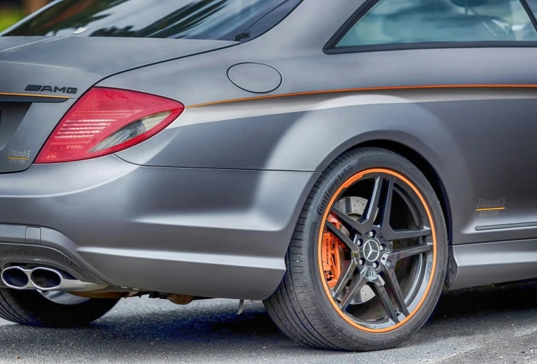 the rear end of a gray sports car