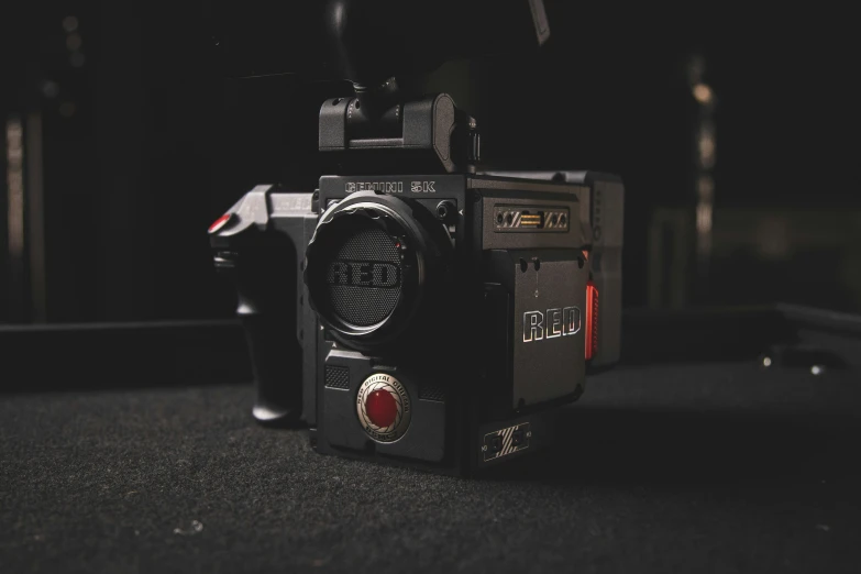 an old fashioned camera sitting on top of a counter