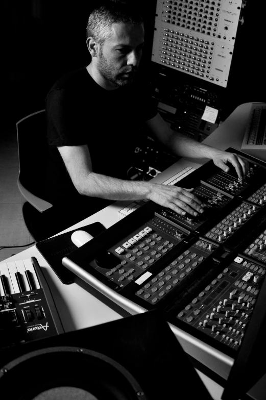 a black and white image of an audio mixing console