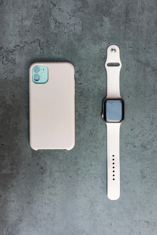 an apple watch and watch face, set on a table