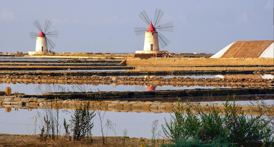 a couple of light houses sitting on top of a pier