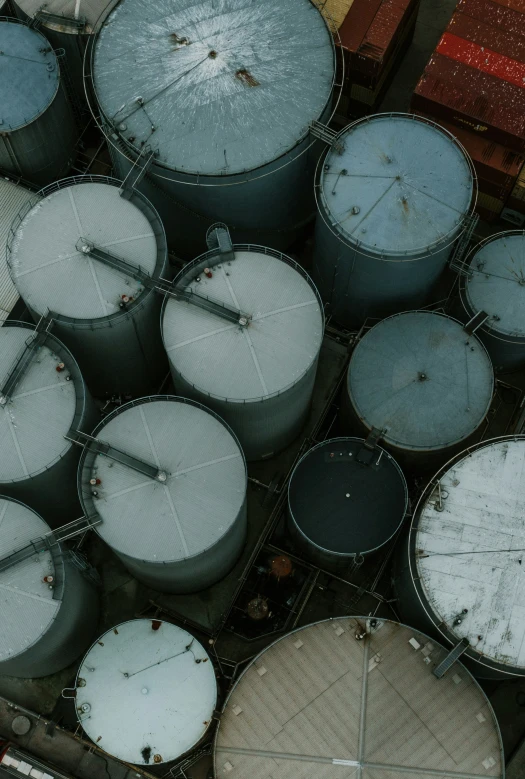 drums in various sizes and colors sitting on the ground