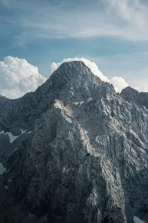 a closeup view of a mountain peak from the bottom