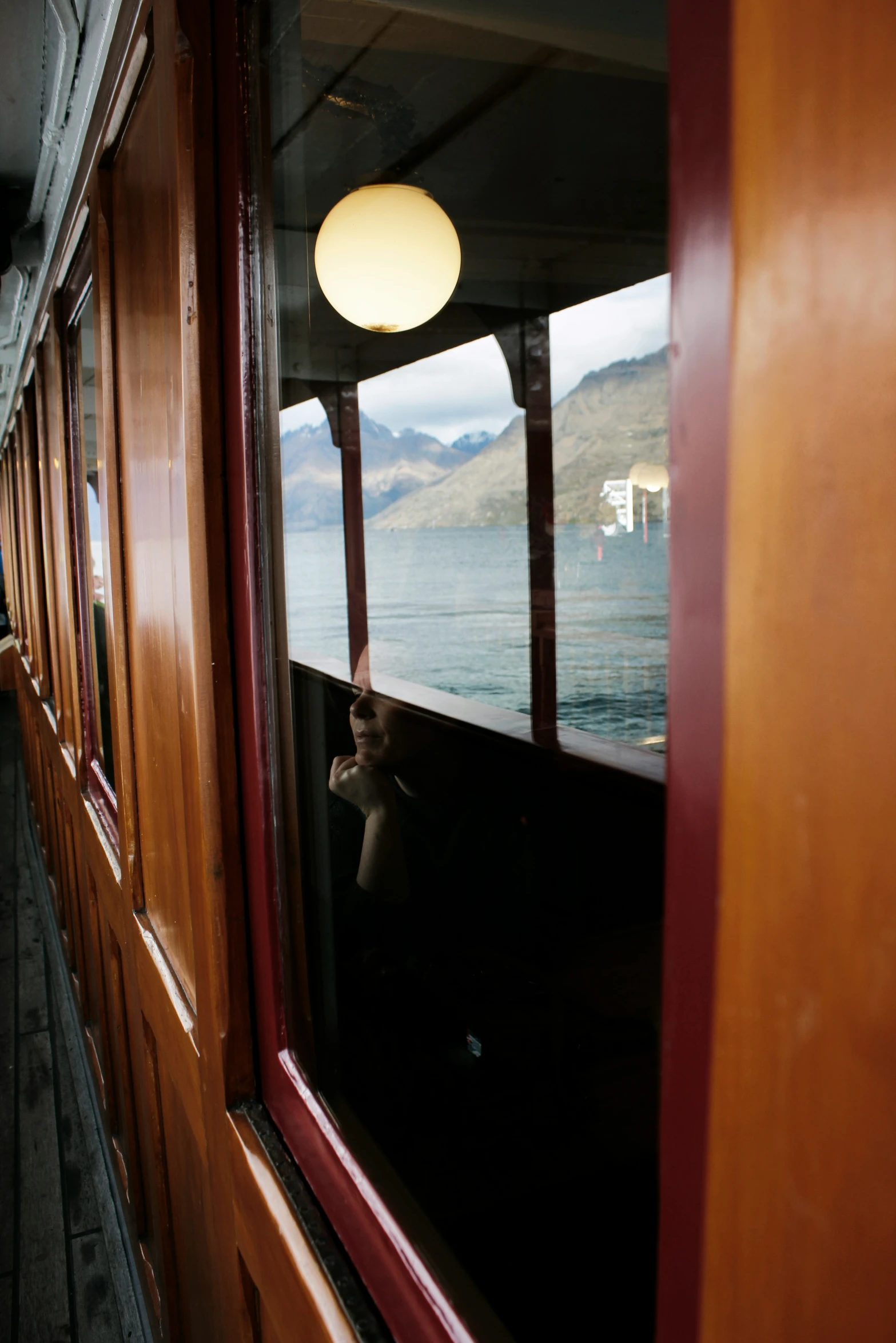 the view from inside a train looking out over the water