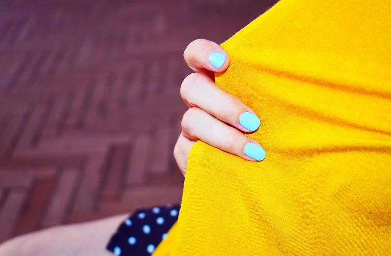 there is a woman's yellow dress with blue dots on it