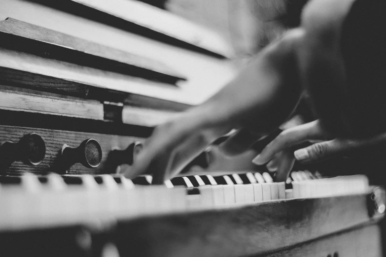 someone playing piano with their fingers on it