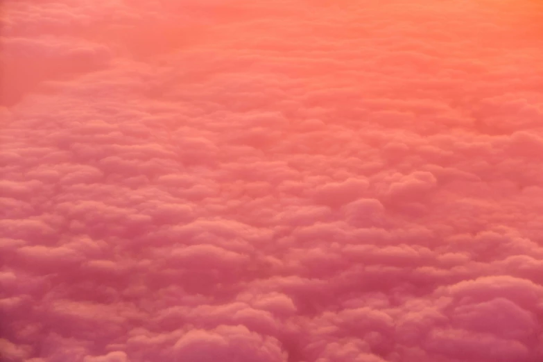 a view of the clouds from an airplane window