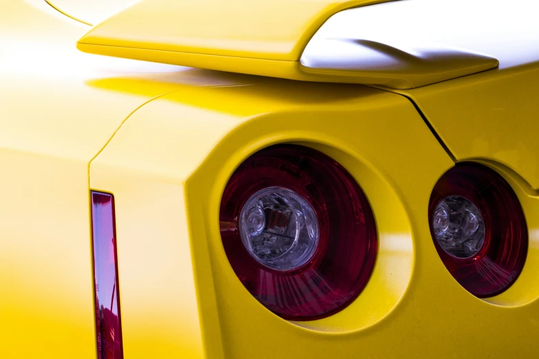 the rear view of a car with its lights turned yellow