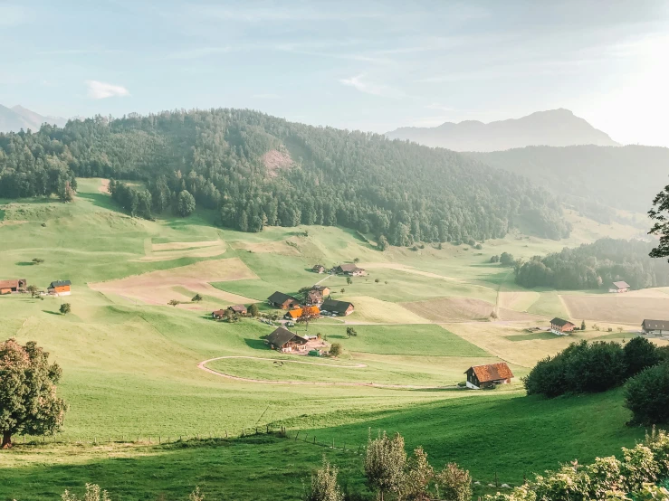 the lush green hills on the side of a mountain range