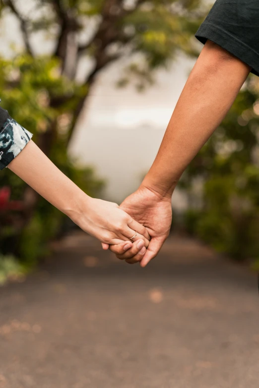 a man and a woman holding hands