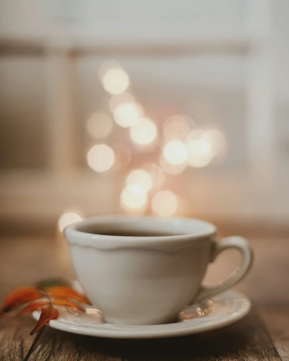 there is a cup with a saucer and spoon on it