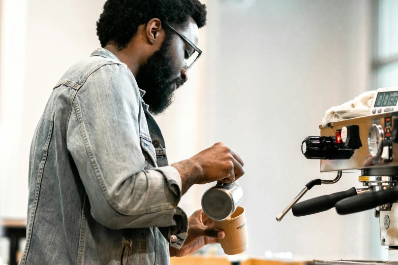 a man with a beard working on some type of machine