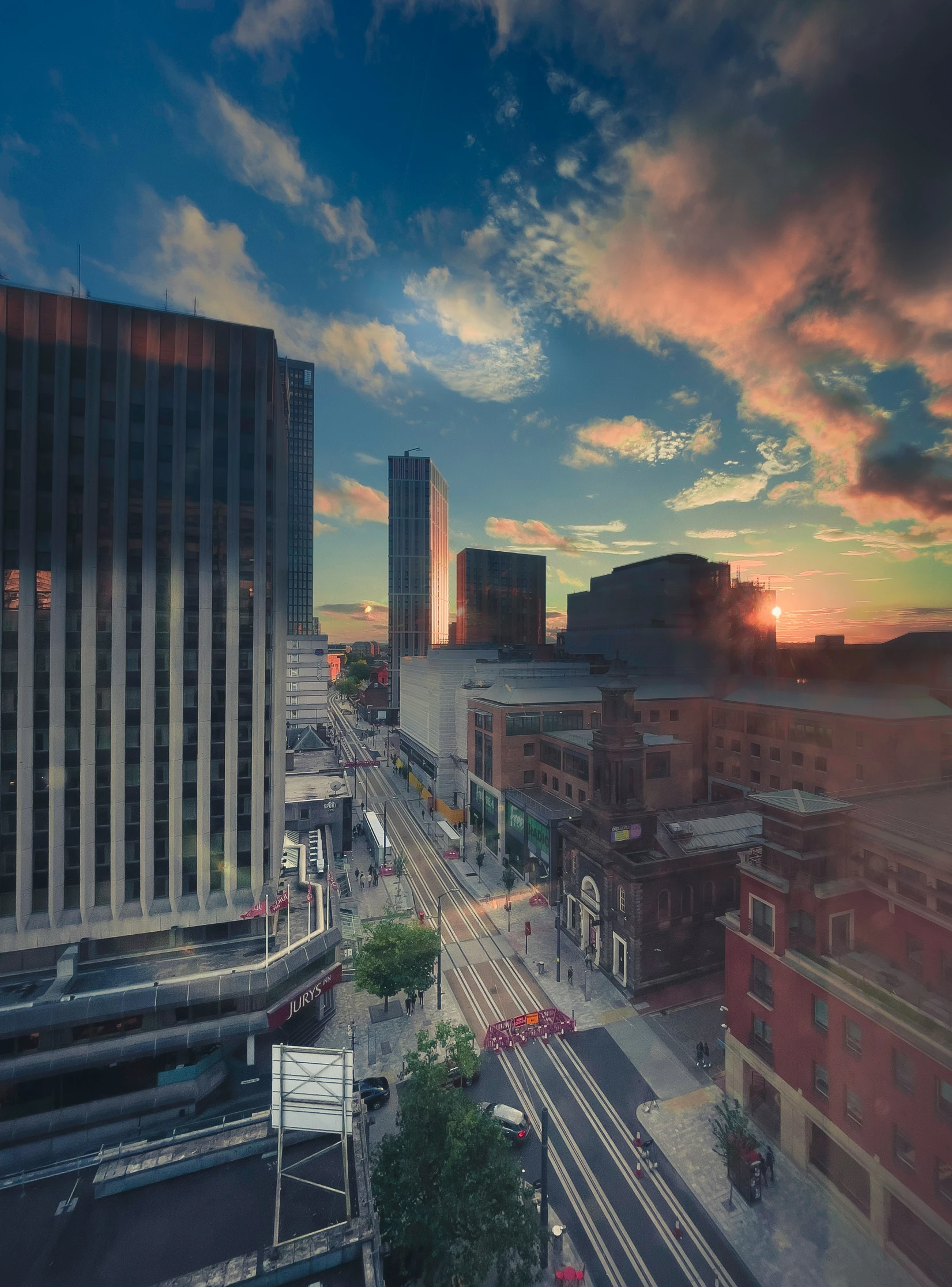 a city skyline taken from the top of a high rise building