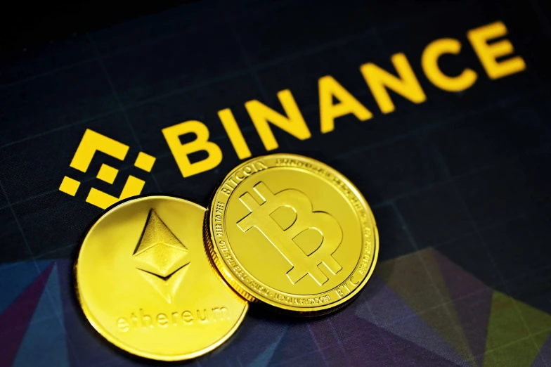 two bitcoins, both gold and silver, with binance