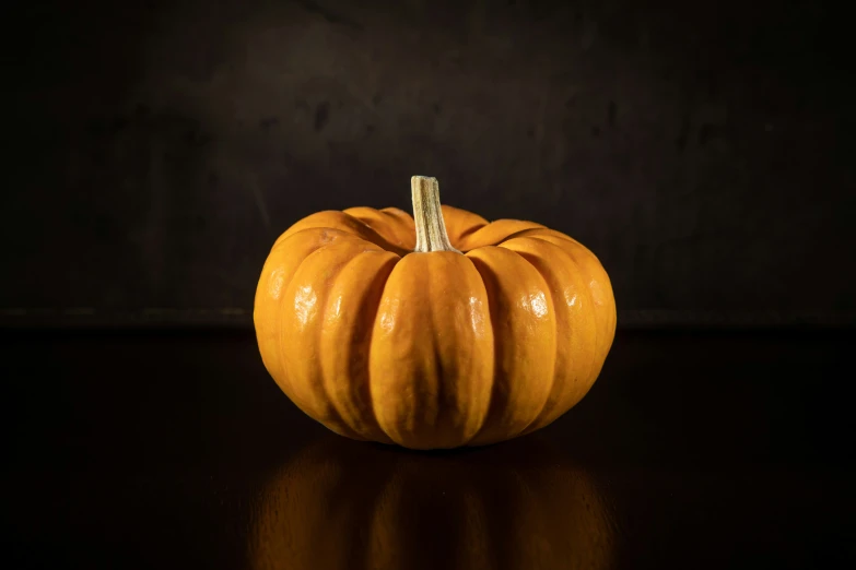 a close up of a pumpkin on a table