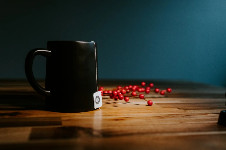 there is a cup on a table with candy flakes in the foreground