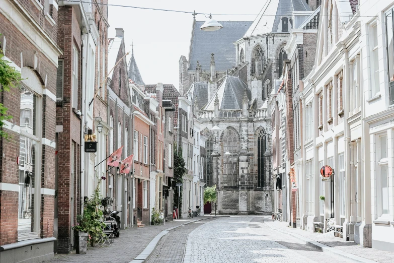 an alley that has tall buildings in it