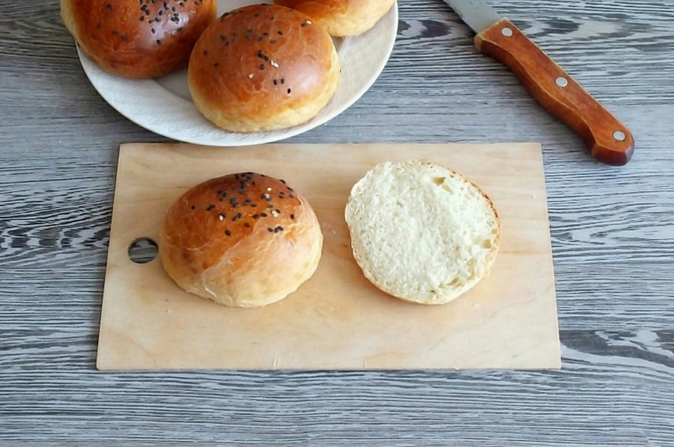 several small rolls and a plate with one