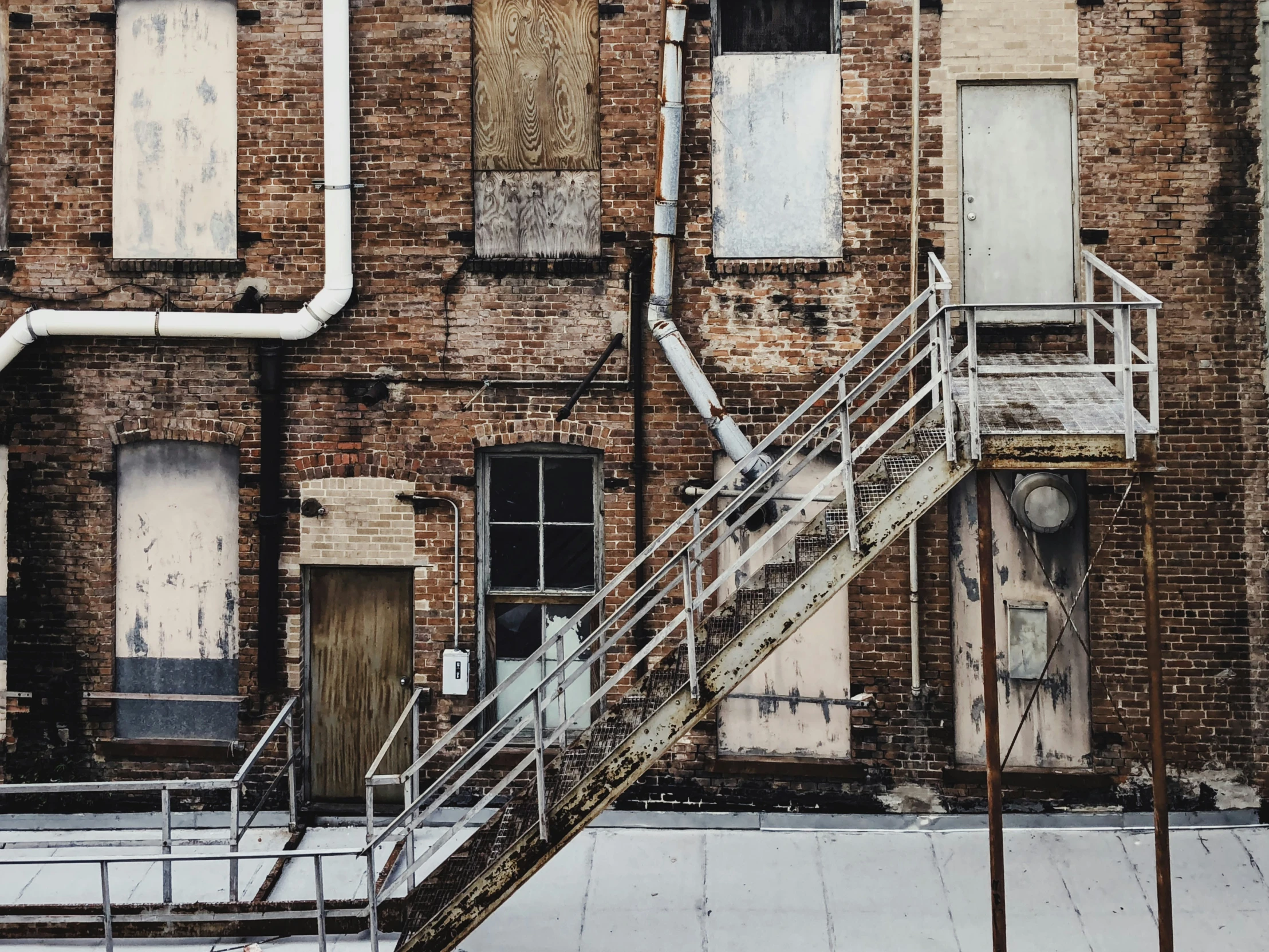 an old brick building with two large stairs