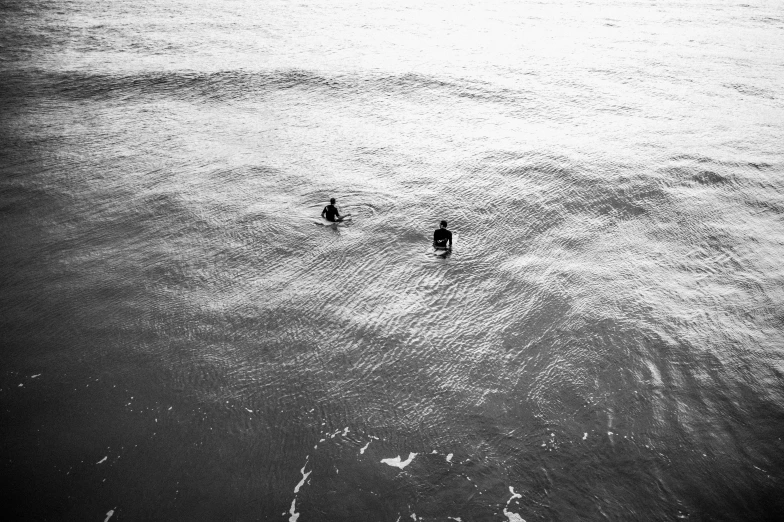 a man walking in a large body of water