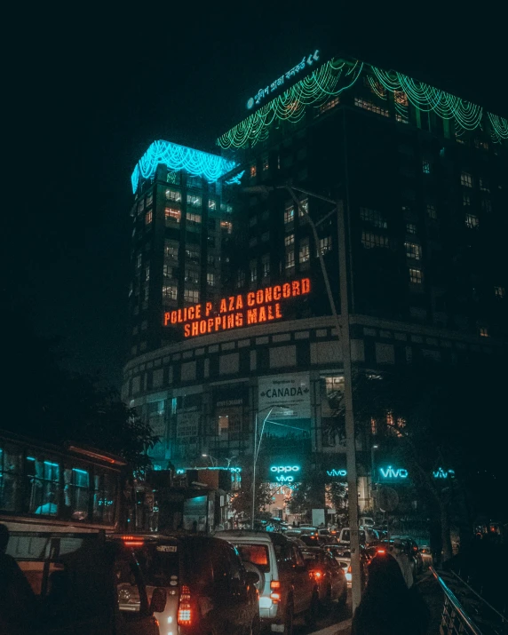 some traffic on a busy city street at night