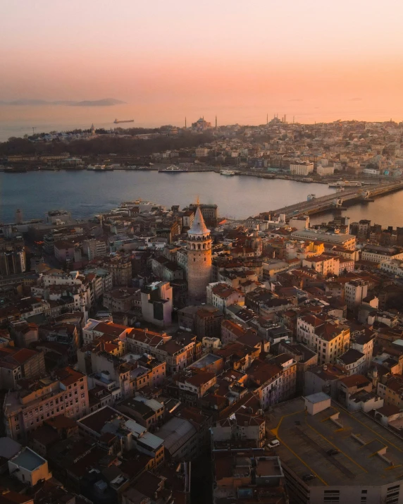 the city is at sunset with lots of tall buildings