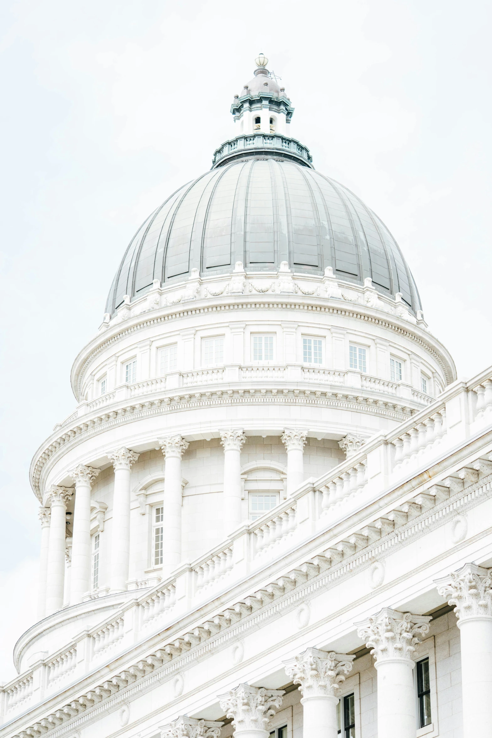 a large white building with a dome in front of it