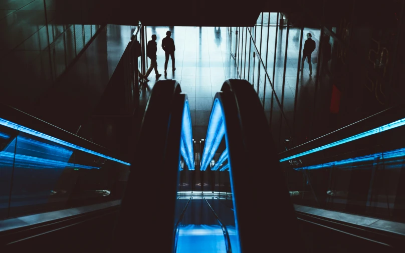 two escalators inside of an empty building