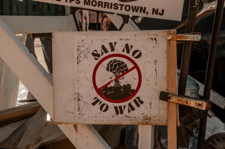 some signs say there is a no war sign in front of it