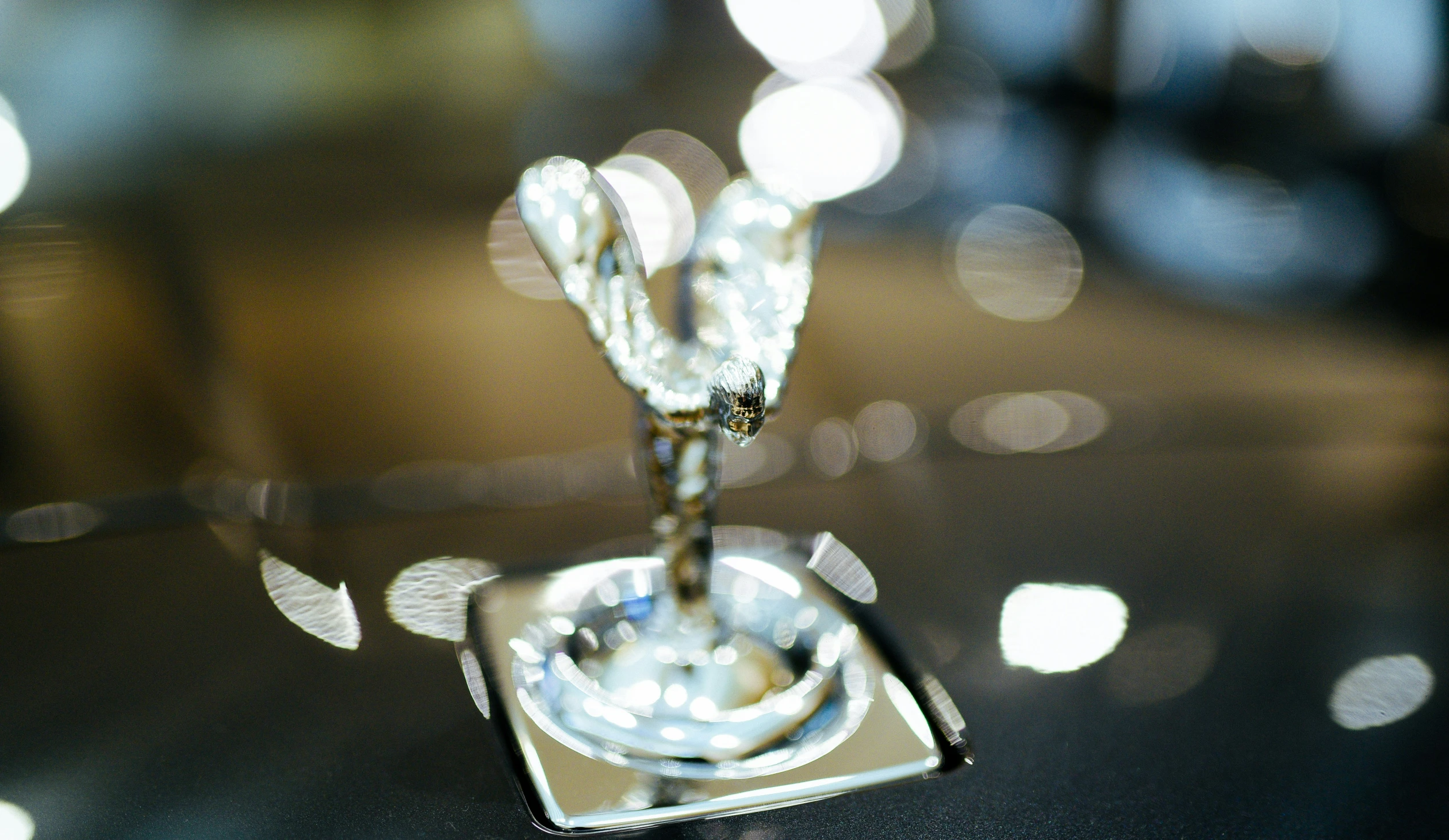 close up of a glass decoration of a small silver object