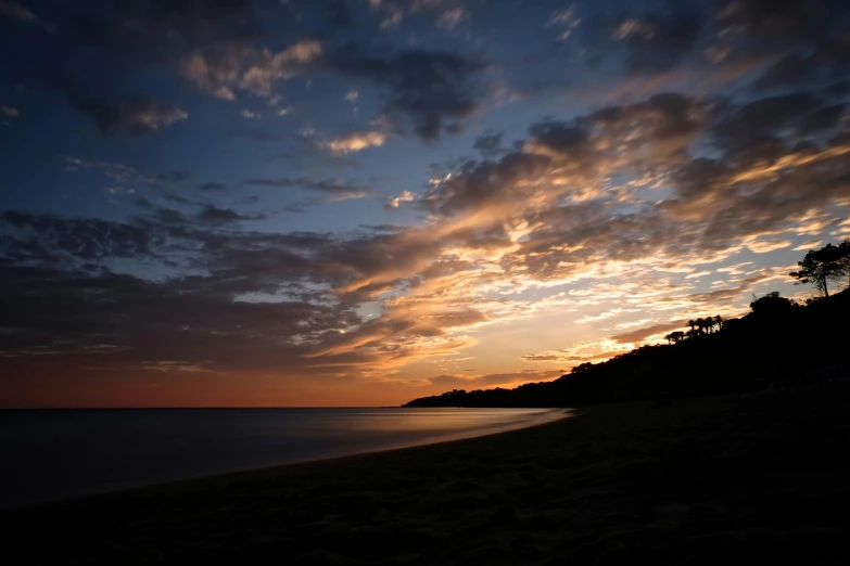 a beautiful sunset with clouds in the sky