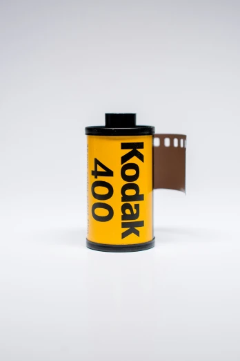 a can of kodak film with the kodak logo in black on it