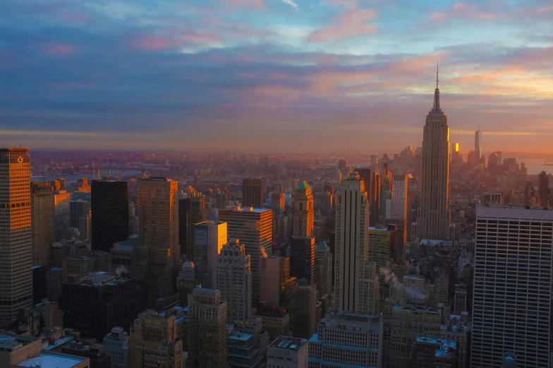 a view of a city from above at sunset