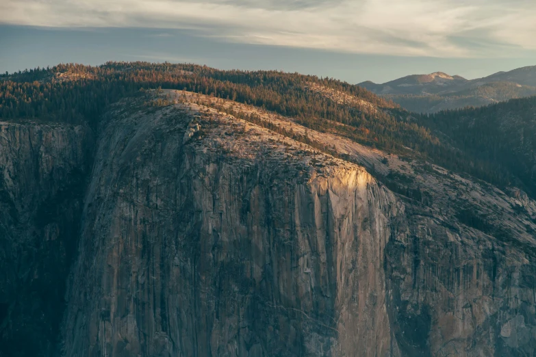 a high mountainside with a mountain on the other side