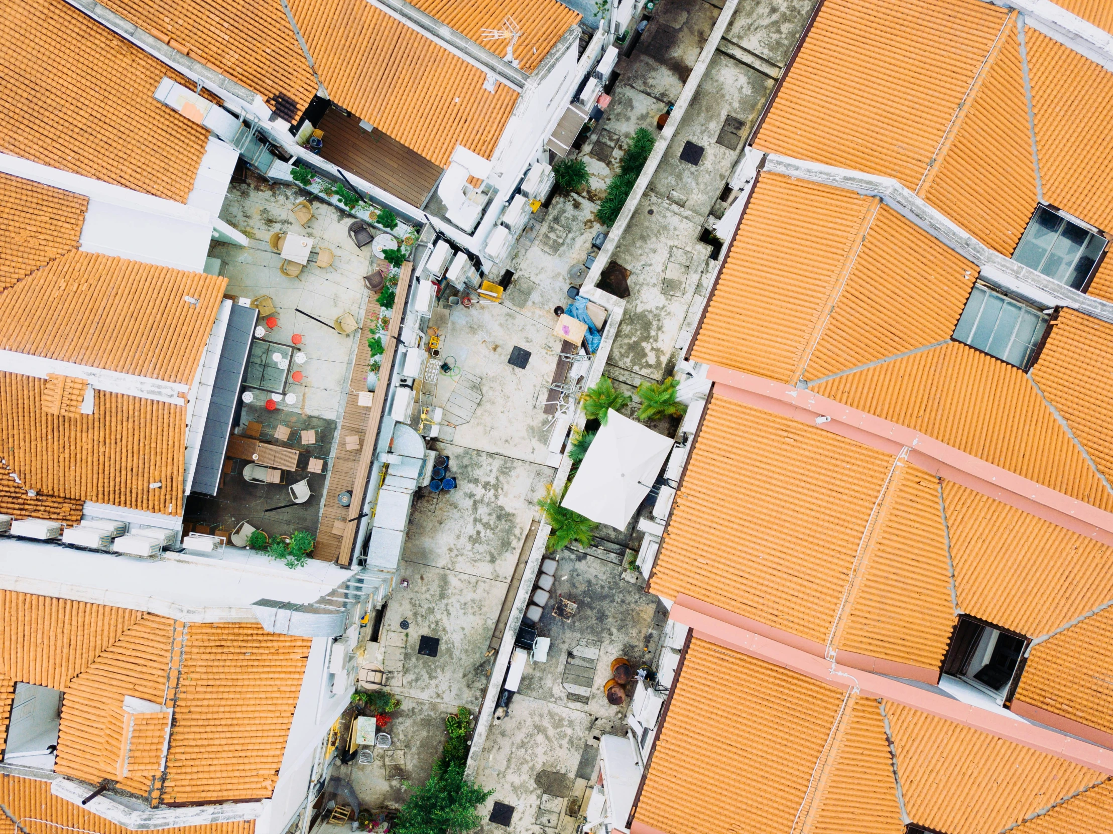 an aerial view of orange roofs in a small town