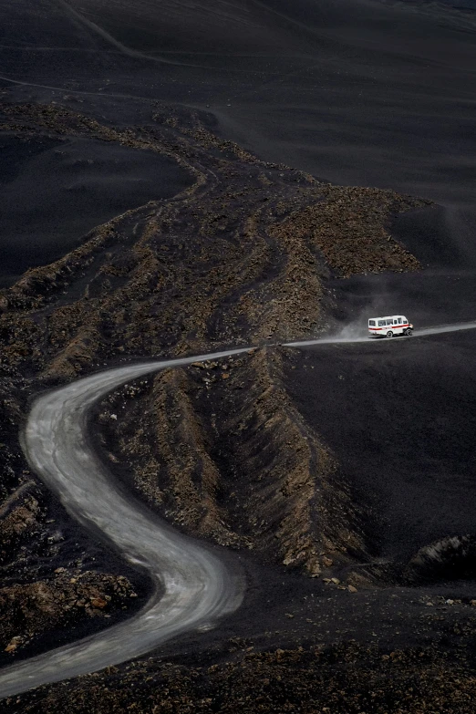 an airplane traveling through a wide open area of land