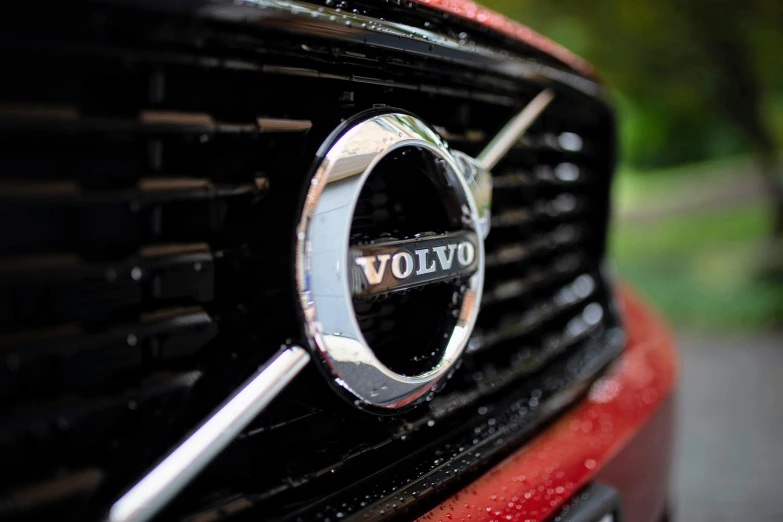 the front grill of a red volvo car