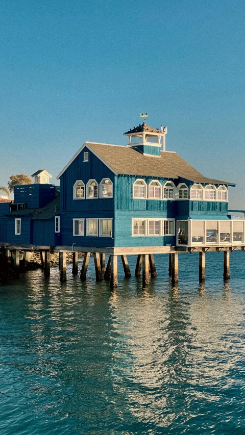 the house is painted blue and has white trim on it