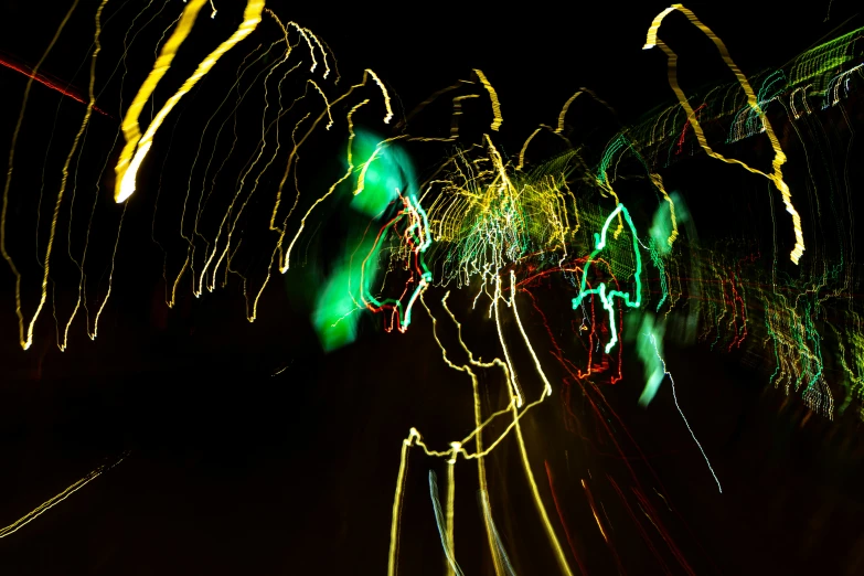 a bright picture of long exposure lights in dark room