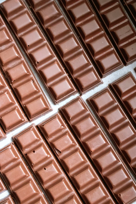 several rows of chocolate bars on top of each other