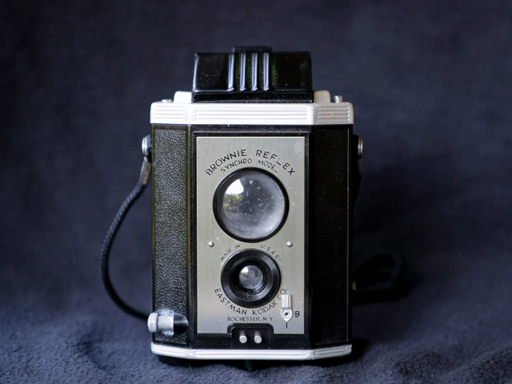 a camera that is sitting on a blue cloth