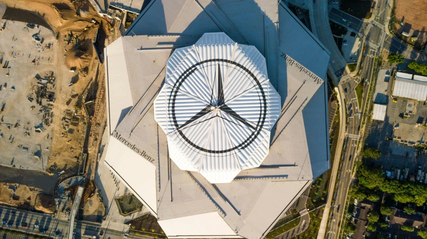 aerial view of building with circular shaped outdoor clock