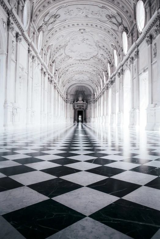 a white and black checkered floor is seen