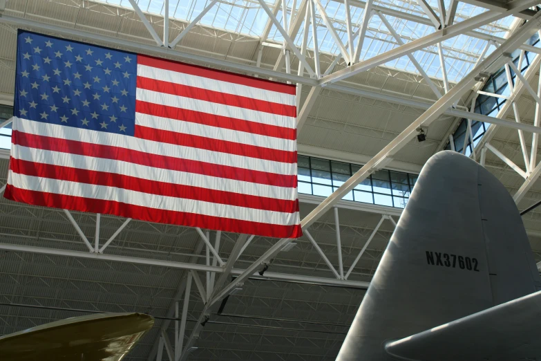 a picture of an american flag hanging from a ceiling