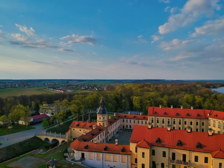 a scenic view of a town with many trees and houses