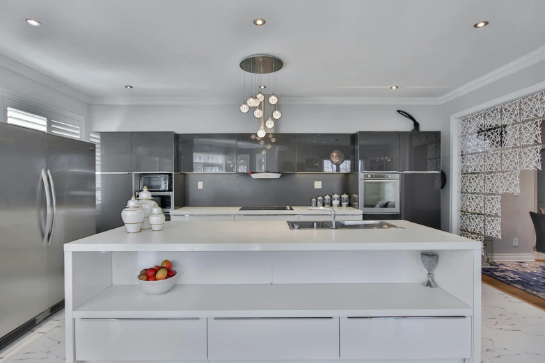 an elegant kitchen with silver and chrome appliances