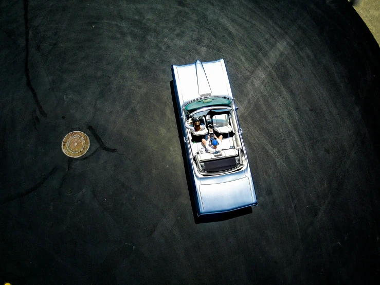 a silver car that is parked on the floor