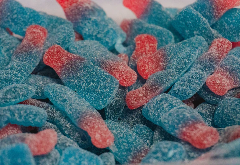 a pile of blue and red candy flakes
